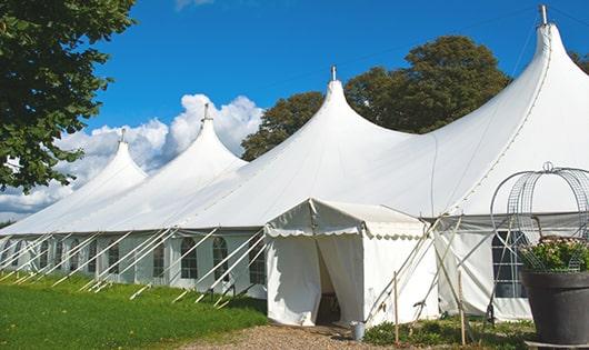 a line of sleek and modern portable restrooms ready for use at an upscale corporate event in Buzzards Bay